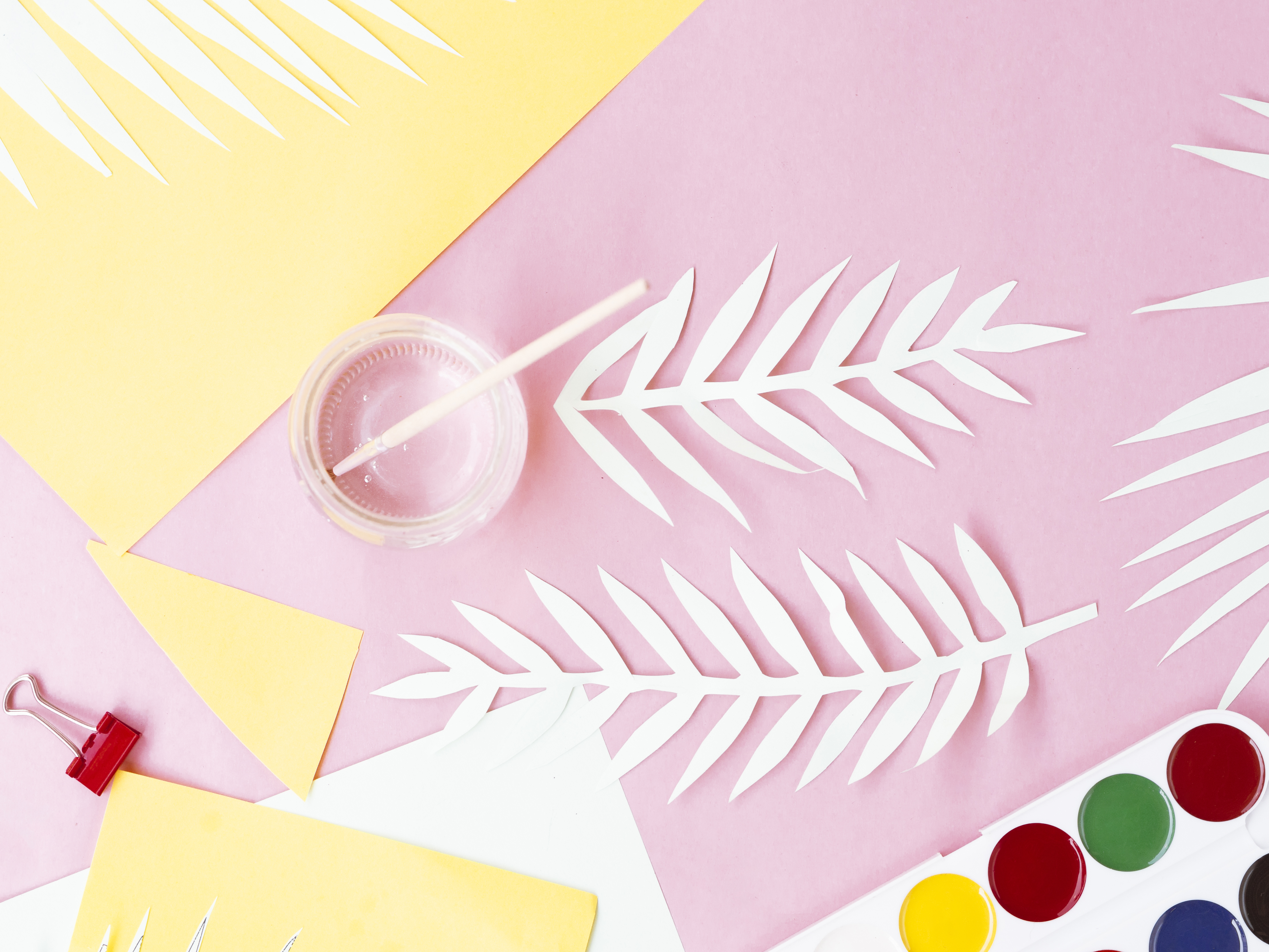 Colorful paper craft workspace with supplies